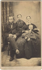An1860's era family poses for a photograph.