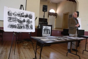 Richard Cummings speaks with area artists Wednesday at the St. Albans Historical Museum. To his right are images from literary and news magazine Frank Leslie’s Illustrated Newspaper, showing a visual rendering of the St. Albans Raid, drawn just three days after it took place in October 1964.  Local artists will recreate the raid again, this time for a 2014 calendar in conjunction with a raid reenactment. 