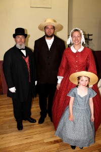 From left: Jim Fouts, Bob Bushnell, Lynn Sawyer, and Mackenzie Smith bring St. Albans back in time, to the 1860s, with Civil War-era clothing as presented Wednesday night at the St Albans Historical Museum’s Bliss Auditorium, itself standing during the St. Albans Raid.