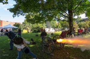 Members of the 9th Battalion Army of Northern Virginia fire their battery at Union forces in a mock battle in Taylor Park during the Aug. 17, 2013 morning artillery demonstration. The action took place during the Third Annual St. Albans Civil War Heritage Weekend. From left to right are: Skip Springer, Ilion N.Y., John Kirkham, Oneida N.Y., Adam Zamta, Utica N.Y., Battery Commander Major John Rathbun, Indian Lake N.Y., Bill Preston, Burlington, and Charles Shapley, Ilion, N.Y. Photo by GEORGE OUELLETTE