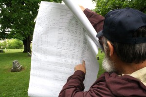 Jim Fouts of the Eighteenth Vermont Regiment searches his records for Civil War-era soldiers laid to rest in the Greenwood Cemetery on South Main Street in St. Albans.