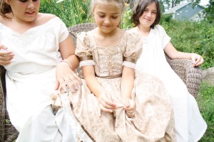 Cindy Leadbeater’s granddaughters, Amanda Powers, left, and Mya Belanger, right, both 11, show off some of the underpinnings Leadbeater has made to go along with the period outfits she has sewn. 