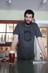 14th Star Brewery brewmaster Dan Sartwell show off his new creation The Raider.