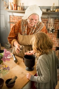 Pat Mead, the Lead Interpreter of Historic Foodways at the Genesee Country Village & Museum in Mumford, N.Y., dressed in period clothing, teaches about food of the 19th Century. - Photo submitted by Pat Mead